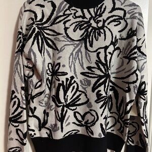 NWT black and white sweater size medium.